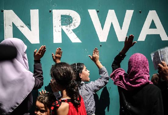 Gazans expressing their feelings outside the offices of the UNRWA