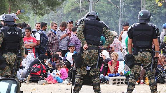 Refugees on Greece side of border facing Macedonia Border control