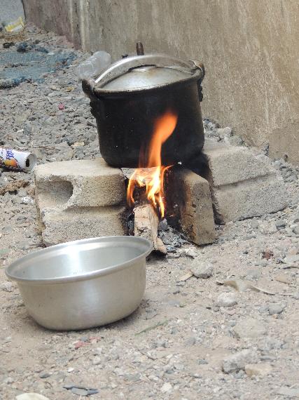 Closeup of Ameen makeshift wood stove