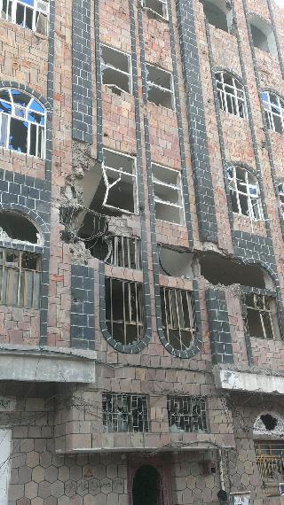 Damage done to residential apartment building from shelling in Al-Shamasi Hiltop neighborhood