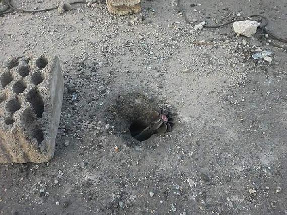 Unexploded mortar in the ground