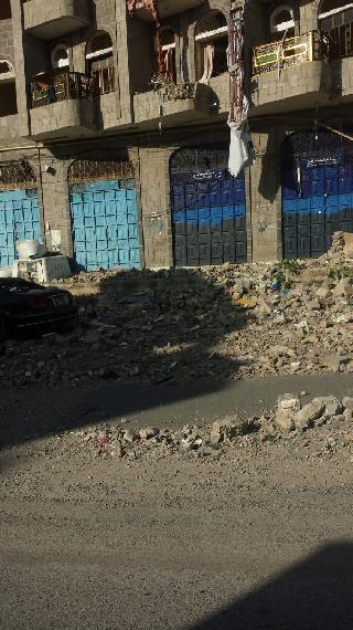 Typical scene in residential neighborhoods throughout Taiz of streets now strewn with ruble from damage done to surrounding buildings