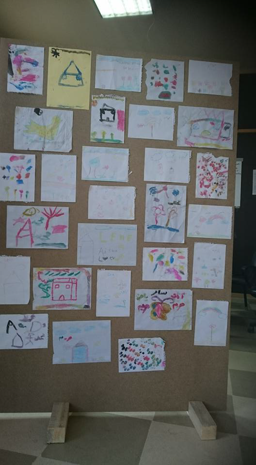 Drawings of 2-6 year old Syrian children. They were either born in the settlement or arrived at a very young age.