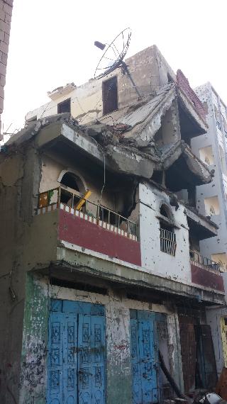 Home of Abdullah in Residential Building in Al-Haseb neighborhood destroyed by coalition air strike