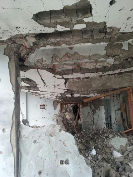 Another view of the damage to the family home of Al-Qadsi family