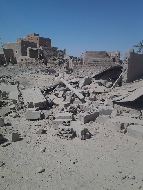 Remnants of building destroyed by air strike in al-Gail district