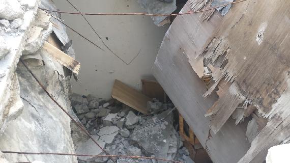 The roof of Gamal’s home where you can see where shells struck, pierced into the interior and exploded 