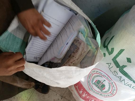 Returned books from students in Hayel Saeed An’am High School, but are unusable and torn apart, they are gathered in flour sack and put aside