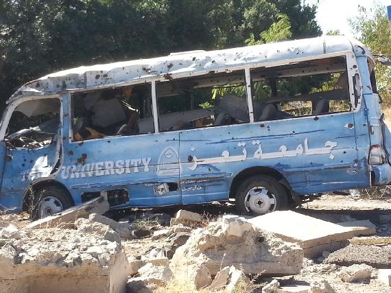 A University bus that has been damage by shrapnel
