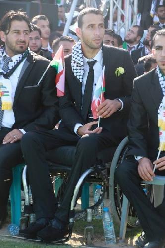 A civilian disabled from the conflict awaiting the marriage ceremony
